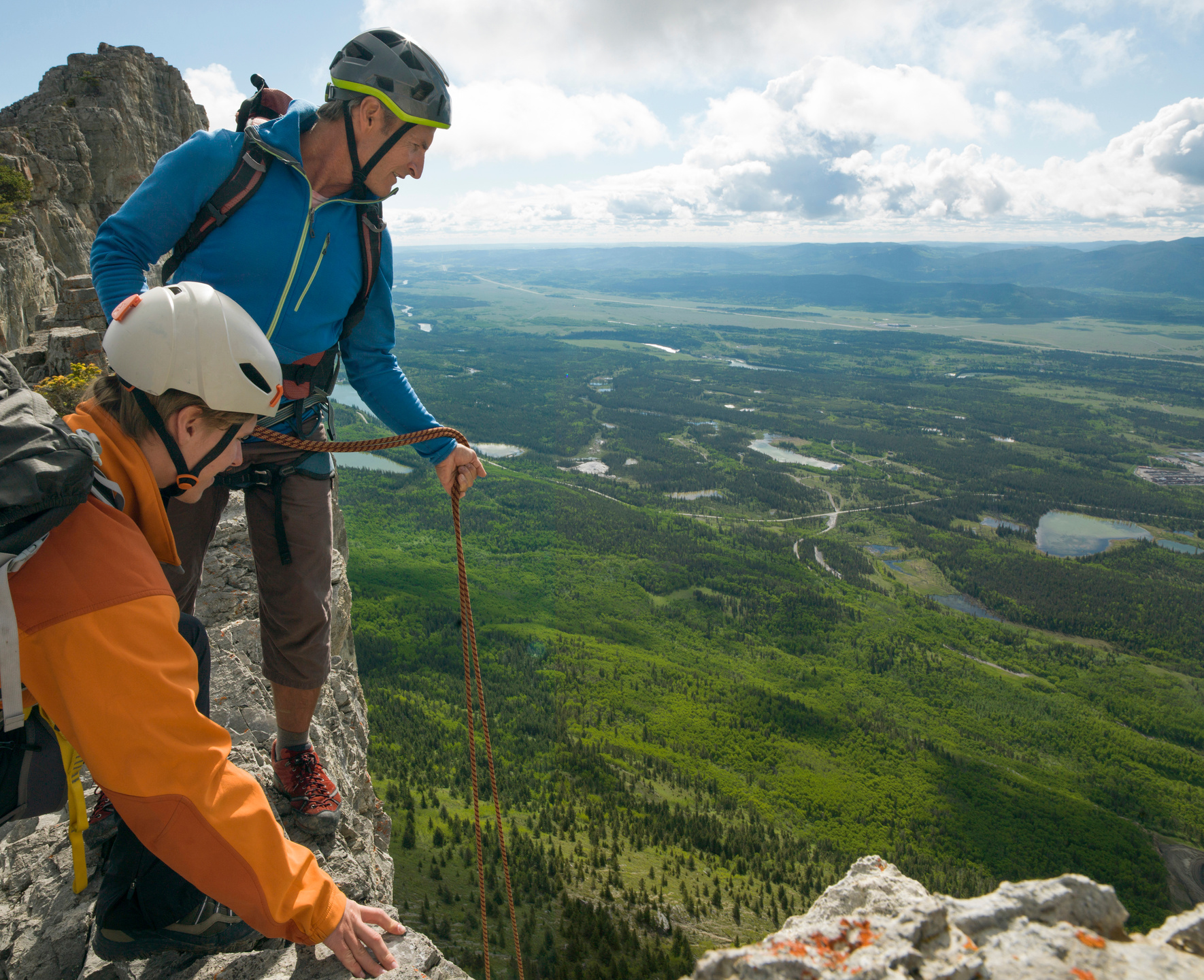 Father and son prepare to rappel (abseil)