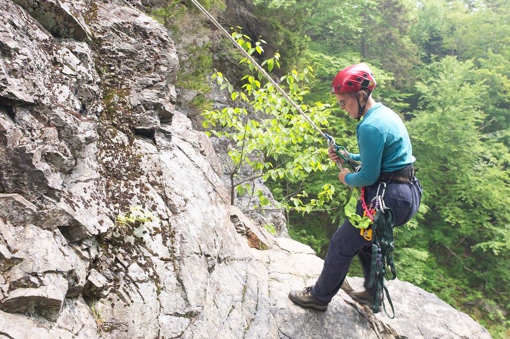 Abseiler standing on a ledge