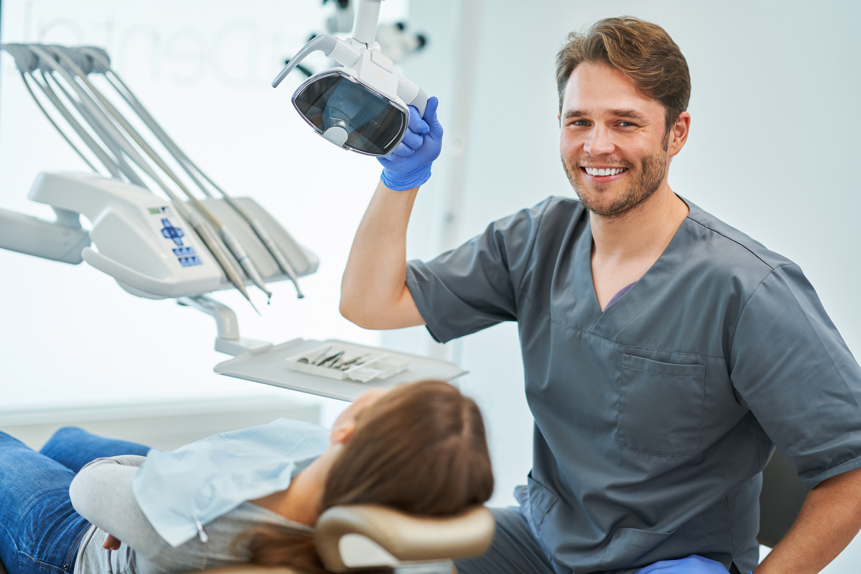 Male Dentist and Woman in Dentist Office